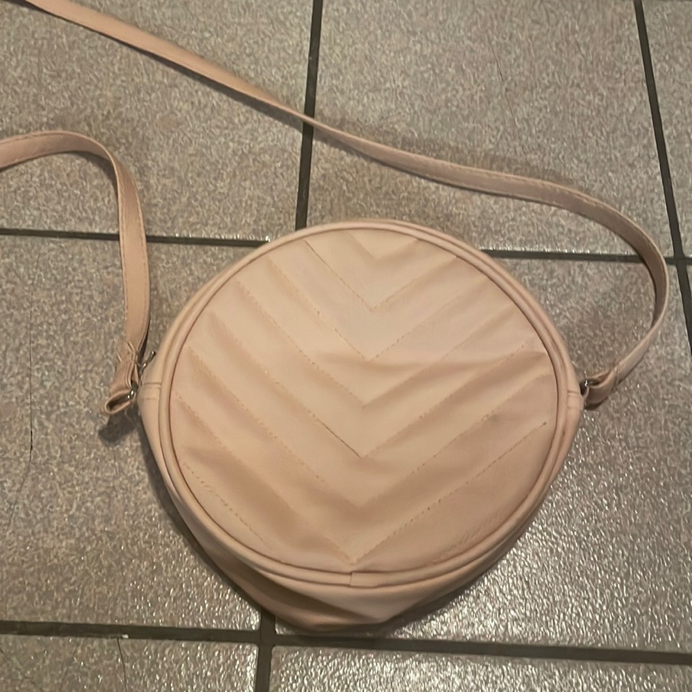 Women’s round shaped pink purse bag